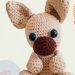 Handmade crochet bulldog pattern plush with large safety eyes, chenille yarn, and oversized ears